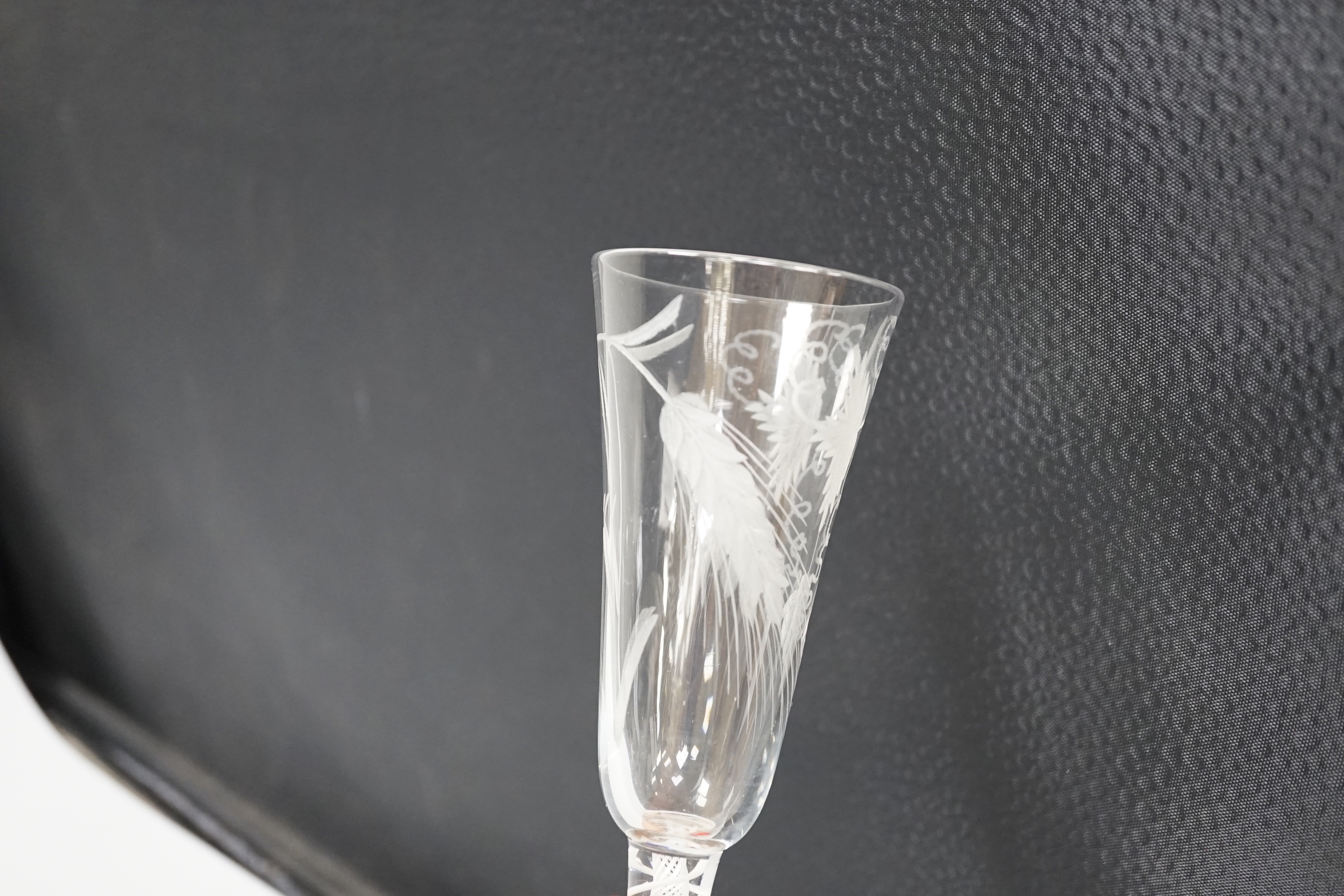 An English lead crystal DSOT ale glass, c.1760, elongated round funnel bowl finely engraved with hops and barley, DSOT stem, pair heavy tapes outside plain gauze, conical foot, snapped pontil, 18.8cm high